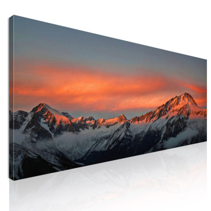 Quadro Montagne Catena Montuosa Innevata Al Tramonto Con Nuvole Arancioni Luminose mow28 quadro stampato su tela